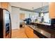 Functional kitchen with stainless appliances, black tiled backsplash, open to living area at 3324 Peachtree Ne Rd # 1104, Atlanta, GA 30326