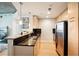 Contemporary kitchen with granite countertops, stainless steel refrigerator, and pendant lighting at 3324 Peachtree Ne Rd # 1104, Atlanta, GA 30326