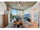 Inviting living room with stylish furniture, a ceiling fan, and an open doorway to the bedroom at 3324 Peachtree Ne Rd # 1104, Atlanta, GA 30326