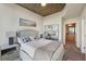 Bright main bedroom with modern decor, large bed, concrete ceilings, and ensuite access at 3324 Peachtree Ne Rd # 1104, Atlanta, GA 30326