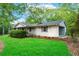 Inviting home exterior featuring a well-manicured lawn and charming curb appeal at 556 Auburn Rd, Auburn, GA 30011