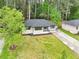 Aerial view of a charming home featuring a well-maintained lawn and mature trees at 117 Hillsdale Dr, Atlanta, GA 30315