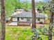 Backyard view showcases the spacious deck, manicured lawn, and privacy fencing at 117 Hillsdale Dr, Atlanta, GA 30315