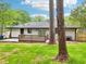 Exterior shot of backyard with wood deck and freshly painted exterior at 117 Hillsdale Dr, Atlanta, GA 30315