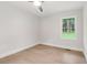 Cozy bedroom with hardwood floors and a bright window overlooking greenery at 117 Hillsdale Dr, Atlanta, GA 30315