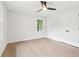 Bedroom featuring a ceiling fan, light hardwood floors, and natural light at 117 Hillsdale Dr, Atlanta, GA 30315