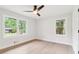 Bedroom with great natural light, ceiling fan, and light hardwood floors at 117 Hillsdale Dr, Atlanta, GA 30315