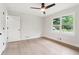 Bright bedroom with ceiling fan, double closet, and exterior view at 117 Hillsdale Dr, Atlanta, GA 30315