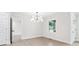 Bright dining area with modern lighting, new flooring, and views of the outdoors at 117 Hillsdale Dr, Atlanta, GA 30315