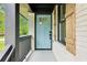 Charming front porch featuring a light blue front door and wooden shutters at 117 Hillsdale Dr, Atlanta, GA 30315