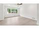 Bright and airy living room featuring large windows and new flooring, great for relaxation at 117 Hillsdale Dr, Atlanta, GA 30315