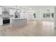 Open concept living space with kitchen island and stainless steel appliances at 117 Hillsdale Dr, Atlanta, GA 30315