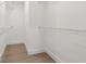 Empty walk-in closet with light hardwood flooring and wire racks at 117 Hillsdale Dr, Atlanta, GA 30315