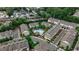 An aerial view shows a neighborhood full of townhomes, a community pool, and manicured streets in a sought-after location at 247 Franklin Rd, Atlanta, GA 30342
