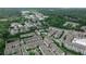 An aerial view shows rooftops of townhomes surrounded by lush green trees nestled in a sought-after location at 247 Franklin Rd, Atlanta, GA 30342