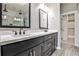 Bathroom featuring a double vanity with granite countertops and modern fixtures at 247 Franklin Rd, Atlanta, GA 30342