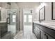 Bathroom featuring a double vanity, walk-in shower, and tile floors at 247 Franklin Rd, Atlanta, GA 30342