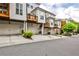 Street view of modern townhomes with private garages and charming balcony spaces at 247 Franklin Rd, Atlanta, GA 30342