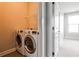 Convenient laundry room with a washer and dryer set and wire shelving at 247 Franklin Rd, Atlanta, GA 30342