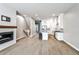 Inviting living space with open kitchen concept, a modern fireplace, and beautiful hardwood floors at 247 Franklin Rd, Atlanta, GA 30342