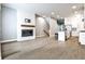 Open living space featuring a fireplace, hardwood floors, and an open kitchen floor plan at 247 Franklin Rd, Atlanta, GA 30342