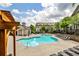Community pool with lounge chairs and nearby cabana surrounded by mature trees at 247 Franklin Rd, Atlanta, GA 30342