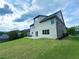 Expansive backyard with a well-manicured lawn and patio, offering plenty of space for recreation and outdoor living at 545 Eldridge Dr, Suwanee, GA 30024