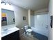 Full bathroom features a vanity, toilet, and a shower-tub combination at 545 Eldridge Dr, Suwanee, GA 30024