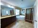 Bathroom featuring soaking tub, tiled floors, shower, and granite countertops at 545 Eldridge Dr, Suwanee, GA 30024