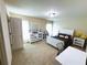Comfortable bedroom with neutral walls, plush carpet, dresser, and white accents providing a relaxing space at 545 Eldridge Dr, Suwanee, GA 30024