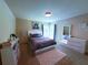 Bedroom features soft lighting, neutral walls, carpet, a dresser and a large mirror creating a restful space at 545 Eldridge Dr, Suwanee, GA 30024