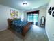 Bright bedroom with floral bedding, natural light, and decorative accents at 545 Eldridge Dr, Suwanee, GA 30024