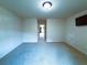 Spacious bonus room with carpeted floors, adjacent room view and a television at 545 Eldridge Dr, Suwanee, GA 30024
