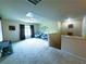 Large carpeted bonus room with projector screen and comfortable seating area at 545 Eldridge Dr, Suwanee, GA 30024