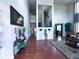 Elegant foyer featuring gleaming hardwood floors, high ceilings, sophisticated decor, and staircase access at 545 Eldridge Dr, Suwanee, GA 30024