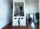 Open foyer area showcasing hardwood floors, high ceilings, wainscoting, and an open staircase at 545 Eldridge Dr, Suwanee, GA 30024