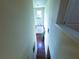 Bright foyer with hardwood floors, chandelier, and elegant entry door creating a welcoming atmosphere at 545 Eldridge Dr, Suwanee, GA 30024