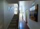 Entryway and stairway featuring hardwood floors, neutral walls, and an art niche at 545 Eldridge Dr, Suwanee, GA 30024