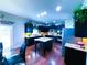 Open floor plan showcasing a modern kitchen with island and stainless steel appliances and lots of lighting at 545 Eldridge Dr, Suwanee, GA 30024