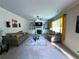 Inviting living room with plush seating, built-in shelving, a cozy fireplace, and lots of natural light at 545 Eldridge Dr, Suwanee, GA 30024
