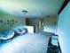 Cozy upstairs living room with comfortable seating, natural lighting, and easy access to the adjacent bathroom at 545 Eldridge Dr, Suwanee, GA 30024