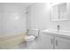 Bright bathroom featuring a tub, toilet, vanity, and elegant tiling at 901 Gettysburg Pl, Atlanta, GA 30350
