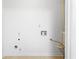 Functional laundry area with hook ups, white walls and neutral tiled flooring at 901 Gettysburg Pl, Atlanta, GA 30350