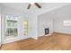 Living room featuring hardwood floors, a fireplace, and a door to the outdoor space at 901 Gettysburg Pl, Atlanta, GA 30350