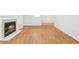 Cozy living room featuring a fireplace with white trim and stylish floor at 901 Gettysburg Pl, Atlanta, GA 30350