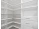 Organized walk-in closet featuring built-in shelves and drawers, maximizing storage space at 901 Gettysburg Pl, Atlanta, GA 30350