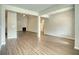 Spacious living room featuring hardwood floors, neutral paint, and an open floorplan at 911 Park Place St, Social Circle, GA 30025