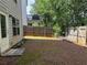 Home with private backyard, wooden fence, and mature trees at 269 Privet Cir, Suwanee, GA 30024