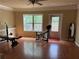 Spacious home gym features wood floors, natural light and weight lifting equipment at 269 Privet Cir, Suwanee, GA 30024