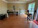Spacious home gym features wood floors, natural light and weight lifting equipment at 269 Privet Cir, Suwanee, GA 30024